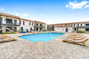 Austin apartment for rent - a large swimming pool in front of a group of apartments