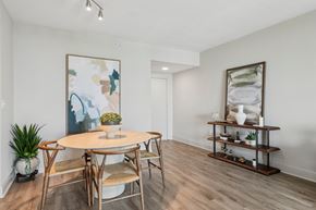 Miami apartment for rent - A dining room with a round table and chairs.