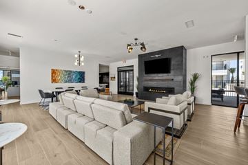 El Paso apartment for rent - a living room with couches and chairs and a fireplace