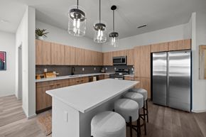 El Paso apartment for rent - a kitchen with a large island and a stainless steel refrigerator