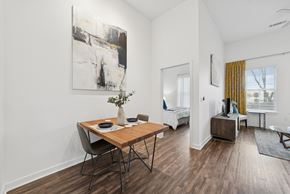 Farmers Branch apartment for rent - A dining room with a wooden table and chairs.