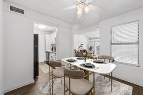 Dallas apartment for rent - A dining room with a white table and chairs.