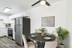 North Las Vegas apartment for rent - A modern kitchen with a dining table set for four.
