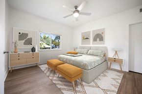 Apopka apartment for rent - a bedroom with a bed and a ceiling fan