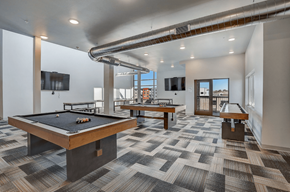 Middleton apartment for rent - A room with a pool table and a tv mounted on the wall.