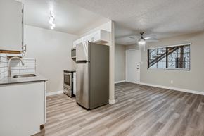 Phoenix apartment for rent - a kitchen and living room with a ceiling fan