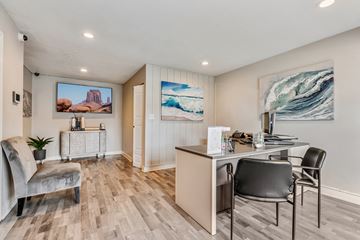 Phoenix apartment for rent - a living room with a desk and a chair and a couch