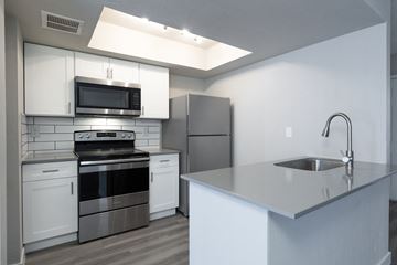 Phoenix apartment for rent - an empty kitchen with stainless steel appliances and a counter top