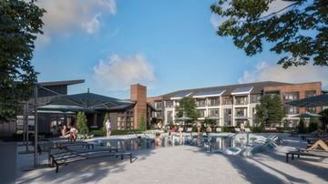 Nashville apartment for rent - A modern building with a pool in front.