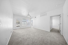 El Paso apartment for rent - A spacious room with a carpeted floor and a ceiling fan.
