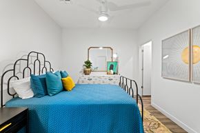 Phoenix apartment for rent - a bedroom with a bed with blue sheets and pillows