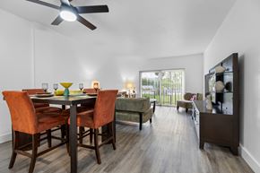 North Miami Beach apartment for rent - A dining room with a table set for two and a ceiling fan.