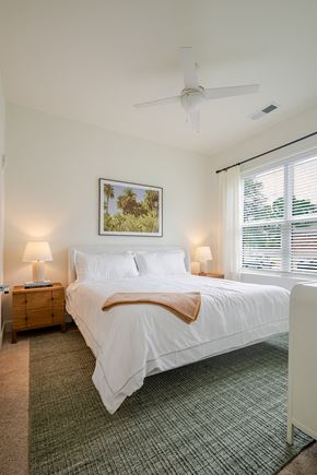 Savannah apartment for rent - A bedroom with a large bed and a painting on the wall.