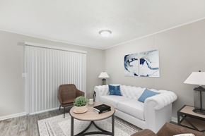 Jonesboro apartment for rent - a living room with a white couch and a coffee table