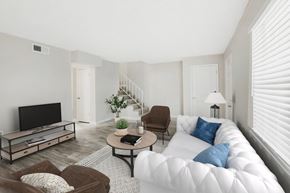 Jonesboro apartment for rent - a living room with a white couch and a tv