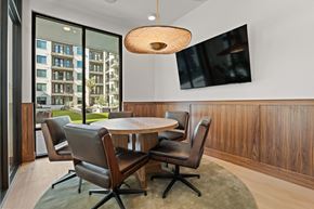 Gilbert apartment for rent - A modern dining room with a round table and chairs.