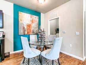 Oklahoma City apartment for rent - a dining room with a glass table and four chairs