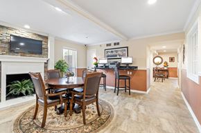 Houston apartment for rent - a dining area with a table and chairs and a fireplace