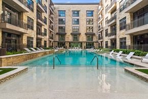 Houston apartment for rent - A large indoor pool in a residential building.