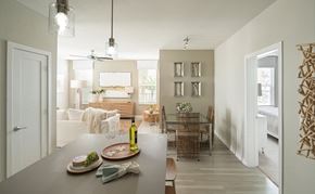Tampa apartment for rent - A modern dining room with a table set for two.