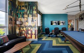 Tampa apartment for rent - A room with a pool table and a couch.
