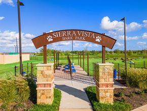 Rosharon apartment for rent - A sign that says Sierra Vista Bark Park in front of a playground.