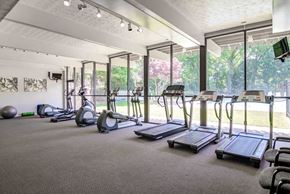Forest Park apartment for rent - A gym with treadmills, exercise bikes, and other equipment.