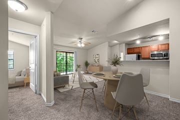 Waco apartment for rent - A modern kitchen with a dining table and chairs.