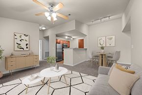 Waco apartment for rent - A modern living room with a grey couch and a white coffee table.