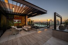 San Diego apartment for rent - a rooftop terrace with a pool and chairs and a television