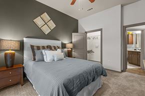 Houston apartment for rent - a bedroom with a large bed and a bathroom