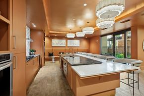 Houston apartment for rent - A modern kitchen with a long counter and a large island.