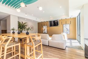 Pooler apartment for rent - A modern dining room with a wooden table and chairs.