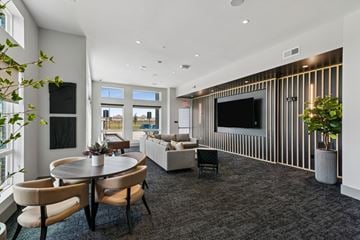 Katy apartment for rent - A modern living room with a round table and chairs.