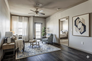 New Braunfels apartment for rent - A living room with a ceiling fan and a rug on the floor.