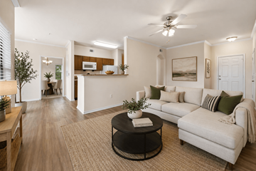 Odessa apartment for rent - A living room with a white couch and a coffee table.