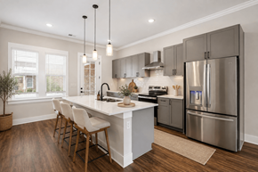 Gallatin townhouse for rent - A modern kitchen with a large island and stainless steel appliances.