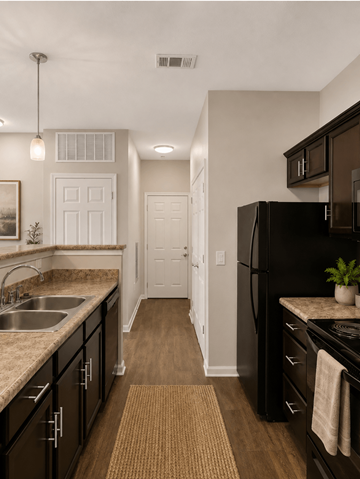 Antioch apartment for rent - A kitchen with black cabinets and a black refrigerator.