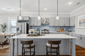 Spring Hill apartment for rent - A modern kitchen with a large island and bar stools.