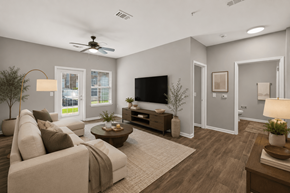 Antioch apartment for rent - A living room with a couch, a coffee table, a television, and a ceiling fan.