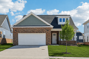 Spring Hill apartment for rent - A house with a white garage door and a brick facade.