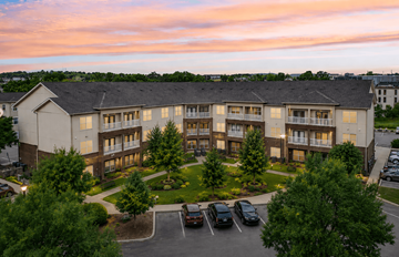 Nashville apartment for rent - A large apartment complex with a parking lot in front.