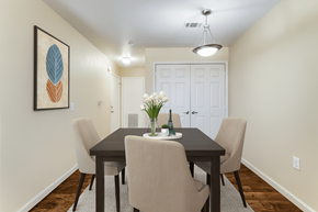 Hobbs townhouse for rent - A dining room with a table and chairs.