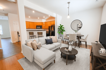 Spring Hill townhouse for rent - A living room with a grey couch and a coffee table.