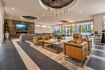 Grand Prairie apartment for rent - A modern living room with a large television and comfortable seating.