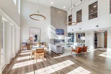 Kingwood apartment for rent - A large open living room with a dining table and chairs.