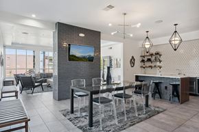 Lone Tree apartment for rent - A modern dining room with a glass table and chairs.