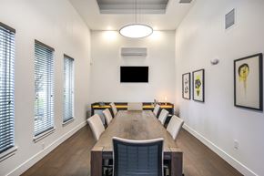 Orlando apartment for rent - A conference room with a long table and chairs.
