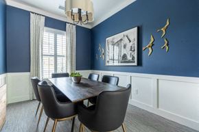 Columbia apartment for rent - a dining room with blue walls and a table and chairs