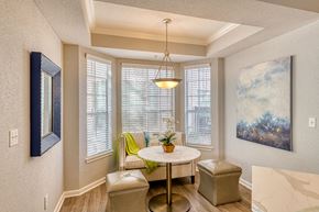 Houston apartment for rent - a dining room with a table and chairs and a window